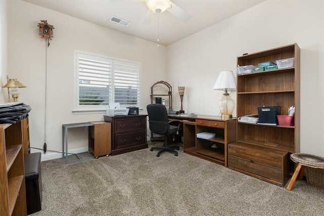 carpeted office featuring visible vents and a ceiling fan