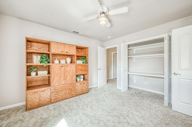 unfurnished bedroom featuring baseboards, a closet, visible vents, and carpet flooring