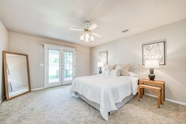 bedroom featuring visible vents, baseboards, light colored carpet, ceiling fan, and access to outside