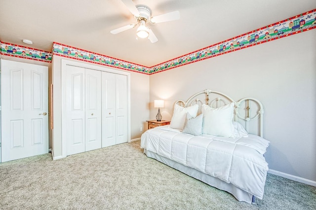 bedroom with carpet floors, a closet, ceiling fan, and baseboards