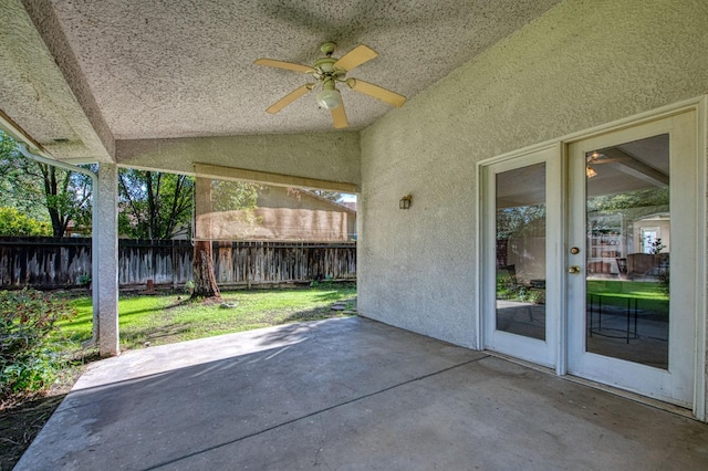 view of patio / terrace with a ceiling fan and fence