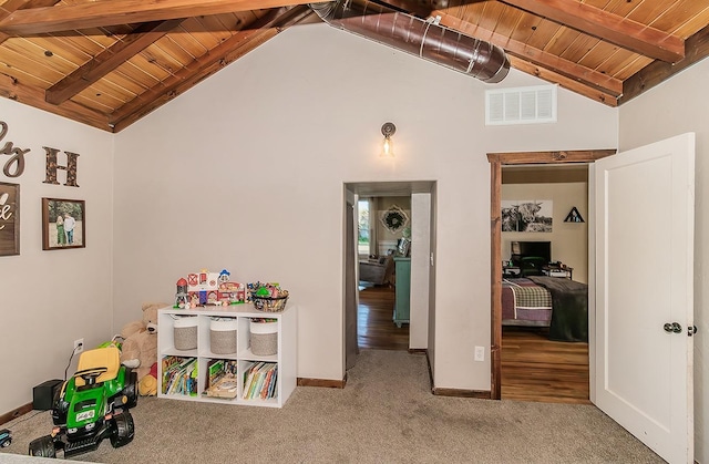 recreation room with wooden ceiling, baseboards, visible vents, and beam ceiling