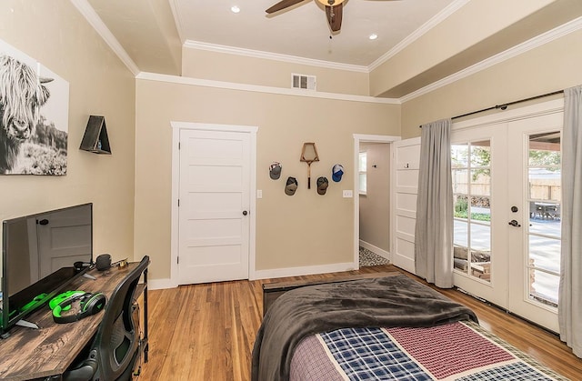 bedroom featuring ornamental molding, access to outside, visible vents, and light wood-style flooring