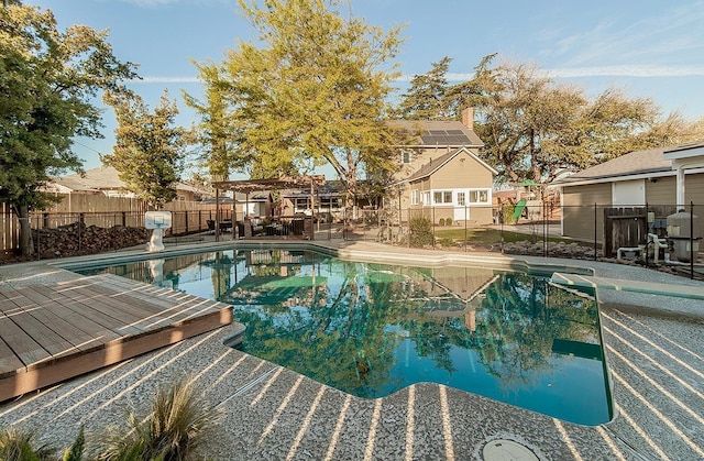 view of swimming pool with a fenced in pool and a fenced backyard