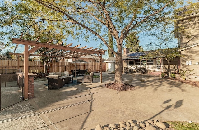 exterior space with an outdoor hangout area, fence, and a pergola