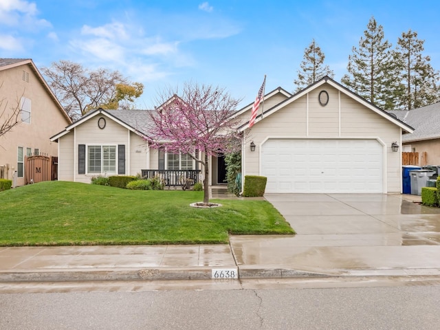 single story home featuring a garage, fence, driveway, a gate, and a front lawn