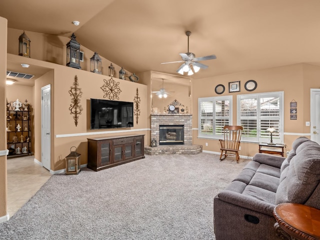 carpeted living area with baseboards, a ceiling fan, lofted ceiling, tile patterned floors, and a brick fireplace