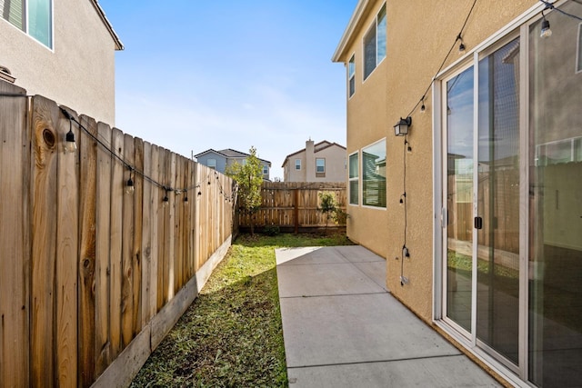 view of yard featuring a fenced backyard and a patio