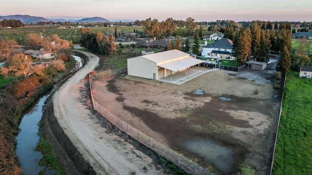 birds eye view of property with a mountain view