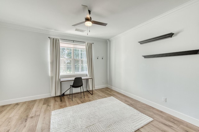 office featuring baseboards, visible vents, a ceiling fan, wood finished floors, and crown molding