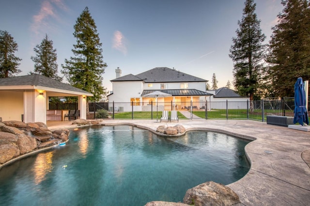 view of swimming pool with a gazebo, a patio area, fence, and a fenced in pool