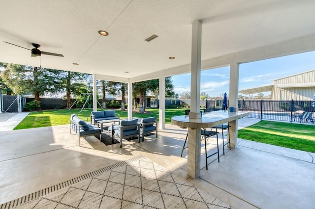 view of patio / terrace featuring a fenced backyard, visible vents, an outdoor living space, and a ceiling fan