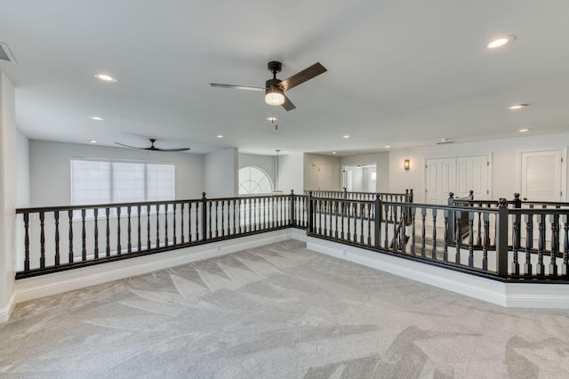 spare room with baseboards, carpet flooring, and recessed lighting