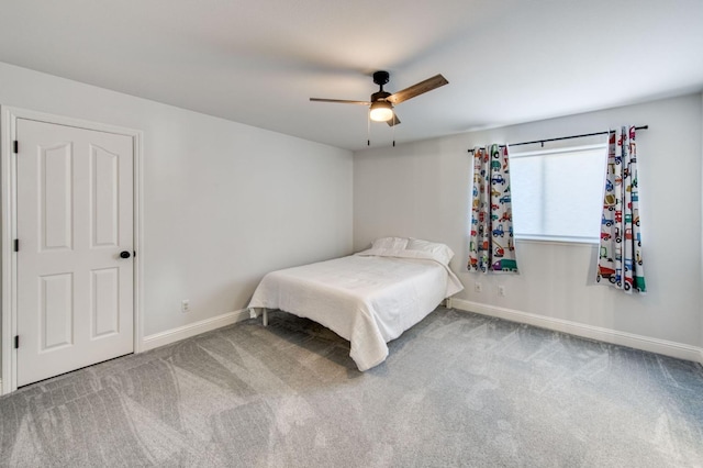 bedroom with carpet floors, a ceiling fan, and baseboards