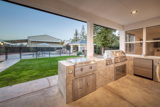 view of patio with a swimming pool, fence, and area for grilling