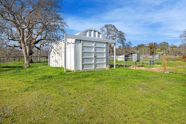 view of shed featuring fence