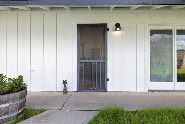 doorway to property with board and batten siding