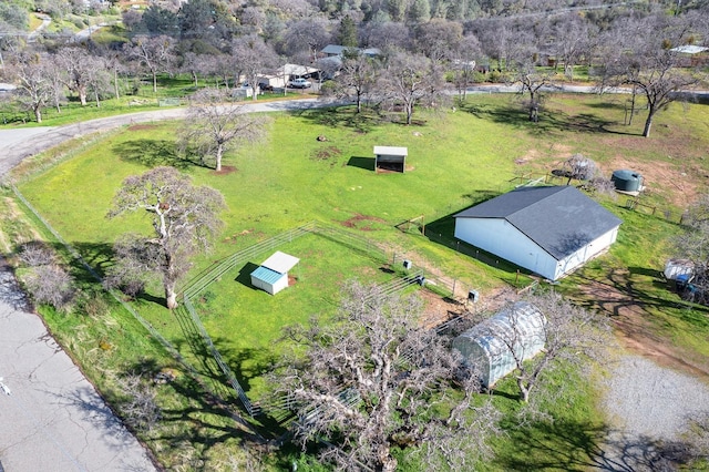 birds eye view of property with a rural view