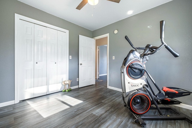 exercise area with ceiling fan, wood finished floors, and baseboards