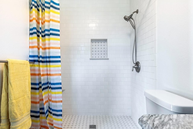 full bath featuring a shower stall