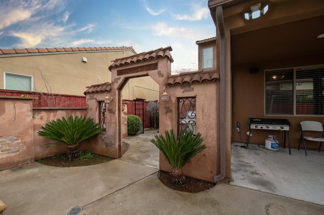 view of patio with fence and area for grilling