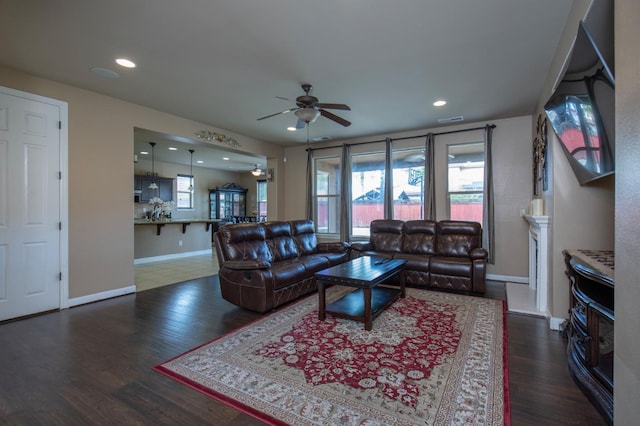 living room featuring recessed lighting, wood finished floors, a ceiling fan, and baseboards