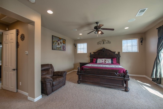 carpeted bedroom with recessed lighting, visible vents, and baseboards