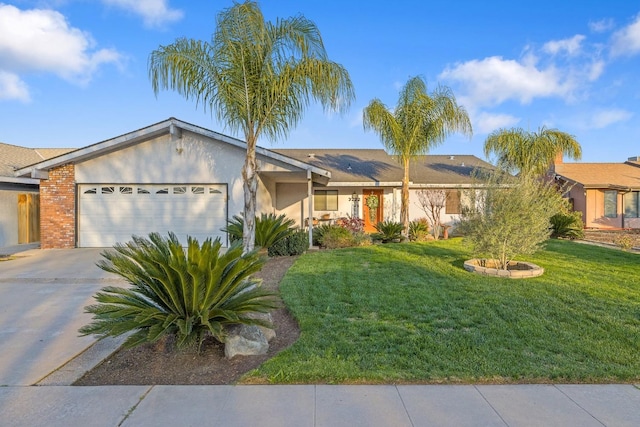 single story home featuring stucco siding, an attached garage, a front yard, roof mounted solar panels, and driveway