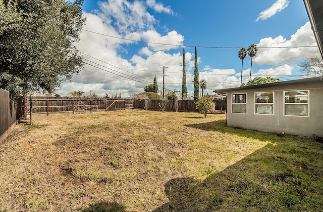 view of yard featuring a fenced backyard