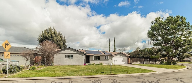 ranch-style house with solar panels, crawl space, fence, driveway, and a front lawn