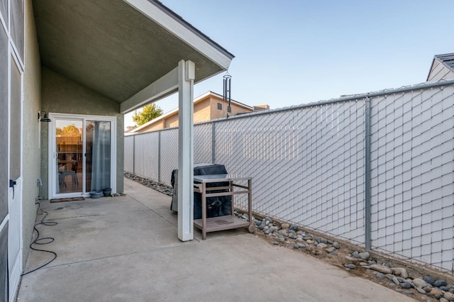 view of patio featuring fence