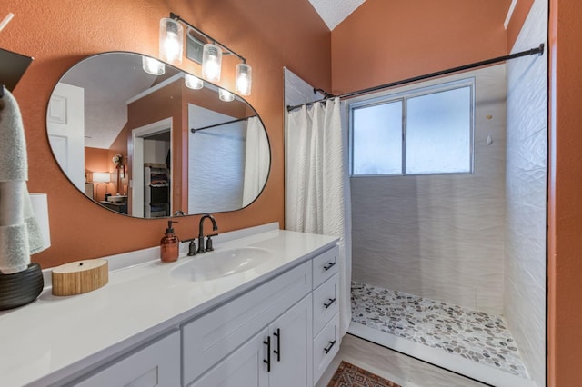 full bath featuring vanity and a shower with curtain