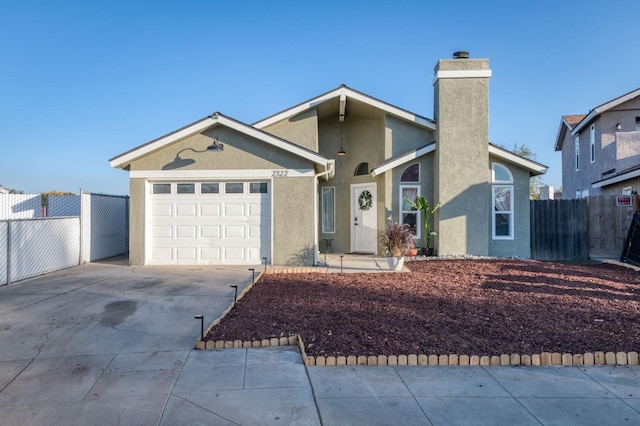 ranch-style home featuring a garage, fence, concrete driveway, stucco siding, and a chimney