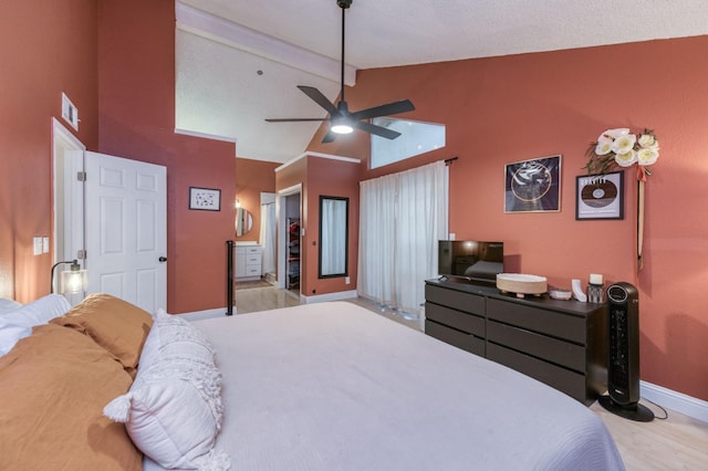 bedroom featuring visible vents, a ceiling fan, wood finished floors, beamed ceiling, and baseboards