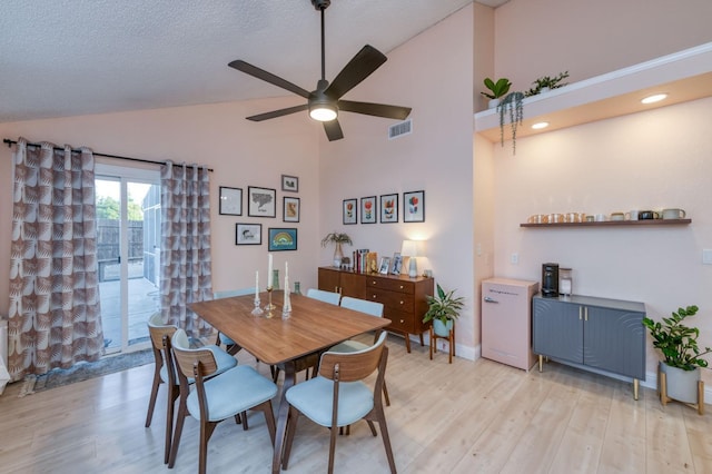 dining space with light wood-type flooring, visible vents, ceiling fan, and baseboards