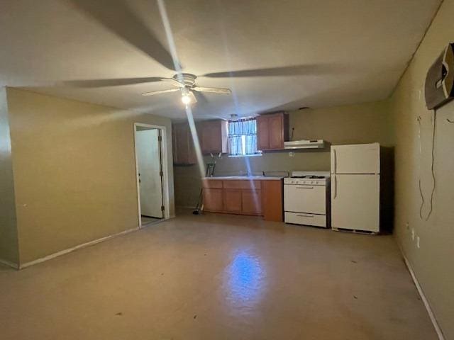 683 E Polk St, Coalinga, CA 93210 - kitchen with white appliances, baseboards, ceiling fan, under cabinet range hood, and brown cabinets