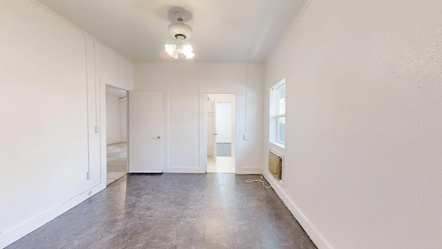 683 E Polk St, Coalinga, CA 93210 - unfurnished room featuring concrete flooring and baseboards