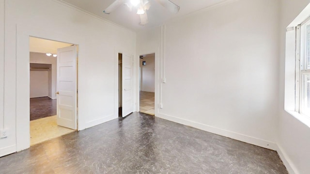 683 E Polk St, Coalinga, CA 93210 - empty room with crown molding, a ceiling fan, baseboards, and a wealth of natural light