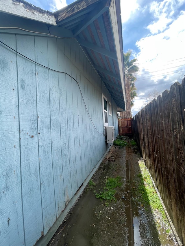 view of side of property with fence