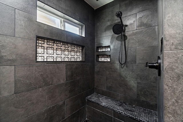 full bath with tiled shower