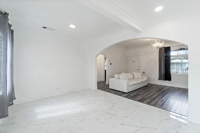 unfurnished living room with arched walkways, marble finish floor, crown molding, recessed lighting, and visible vents