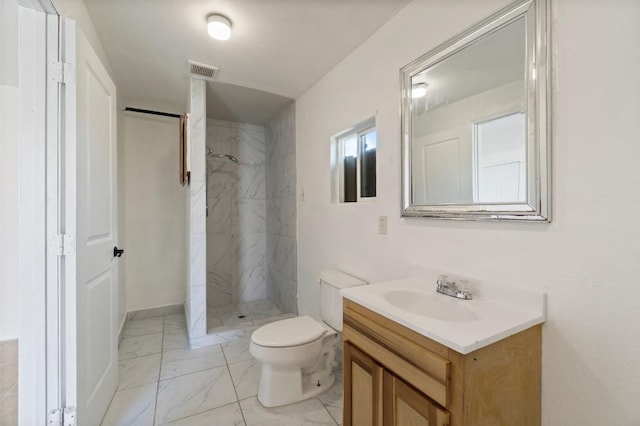 full bath featuring a stall shower, visible vents, toilet, marble finish floor, and vanity