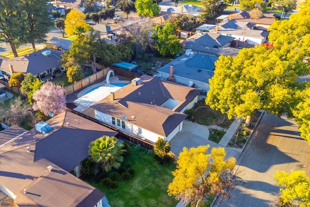 birds eye view of property with a residential view