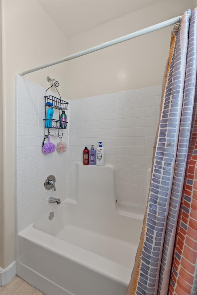 full bath with shower / bathtub combination with curtain