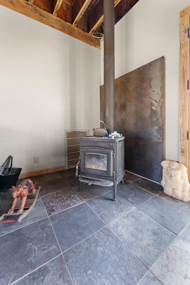 interior details with a wood stove and visible vents