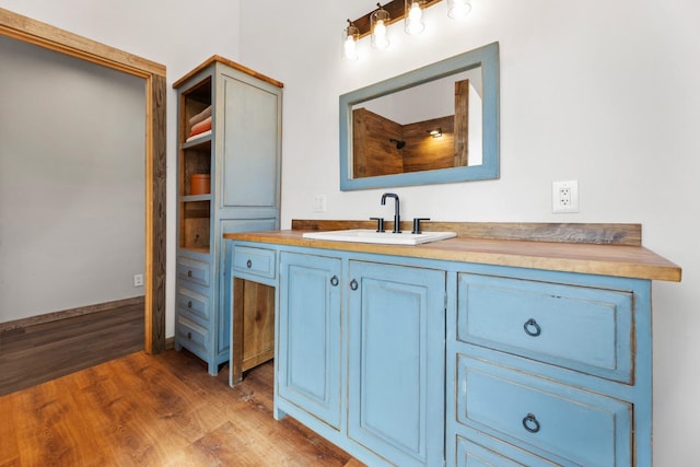 bathroom featuring vanity and wood finished floors