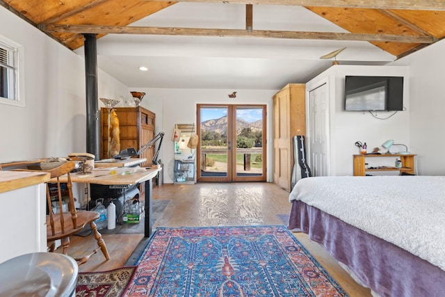 bedroom with vaulted ceiling with beams, access to outside, wood finished floors, and recessed lighting