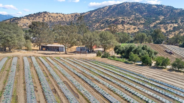 view of mountain feature with a rural view