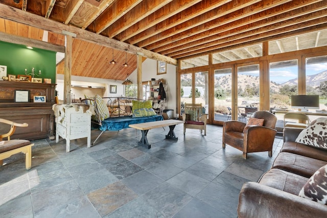 living room featuring stone tile floors and a high ceiling