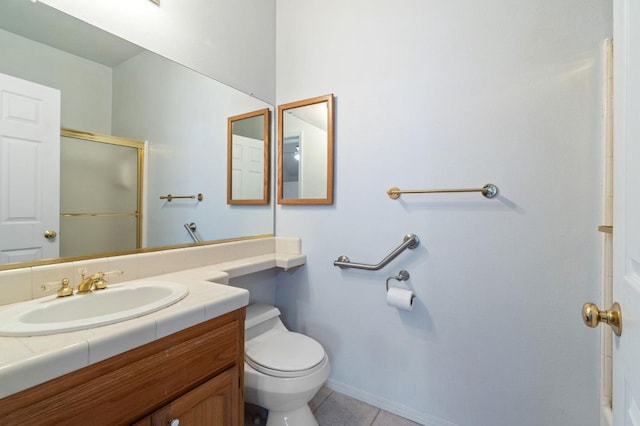 full bathroom with vanity, a shower with door, toilet, and tile patterned floors